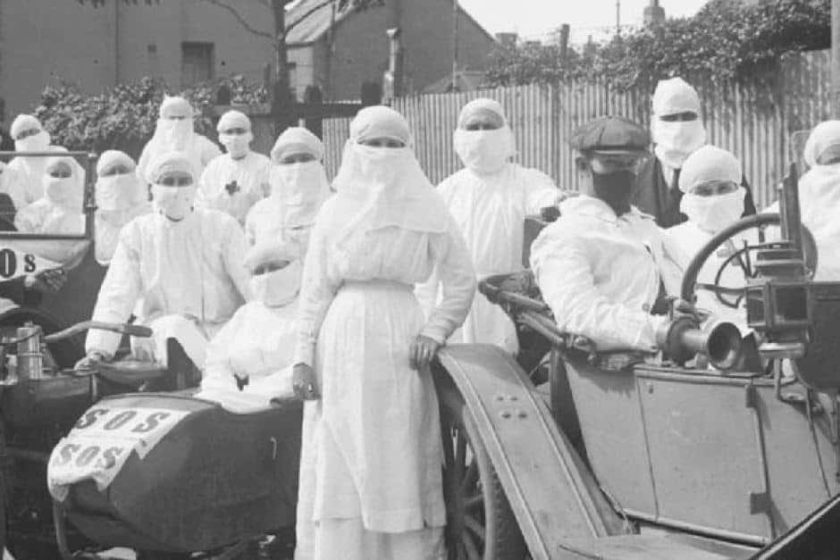 A history of pandemic, a team of doctors and nurses in 1919 pose with quarantine masks on outside Parramatta.